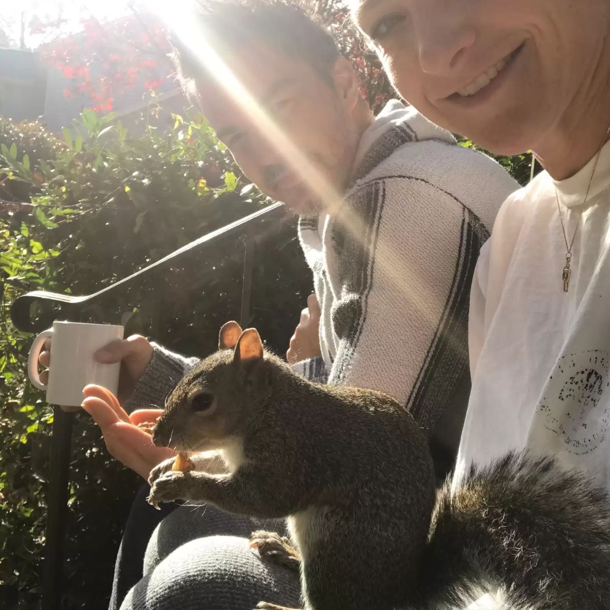 man woman and a squirrel