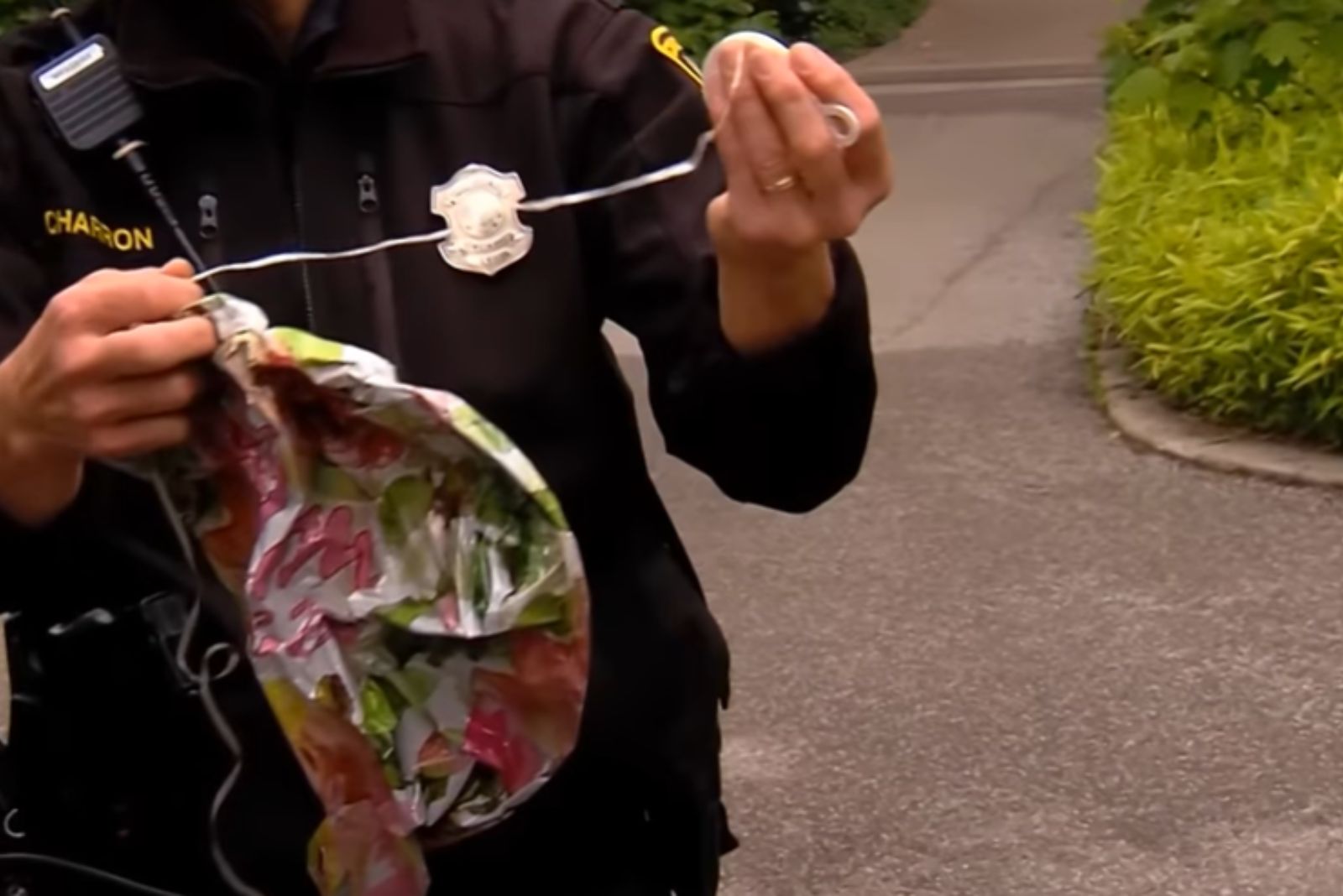 police officer holding a wire