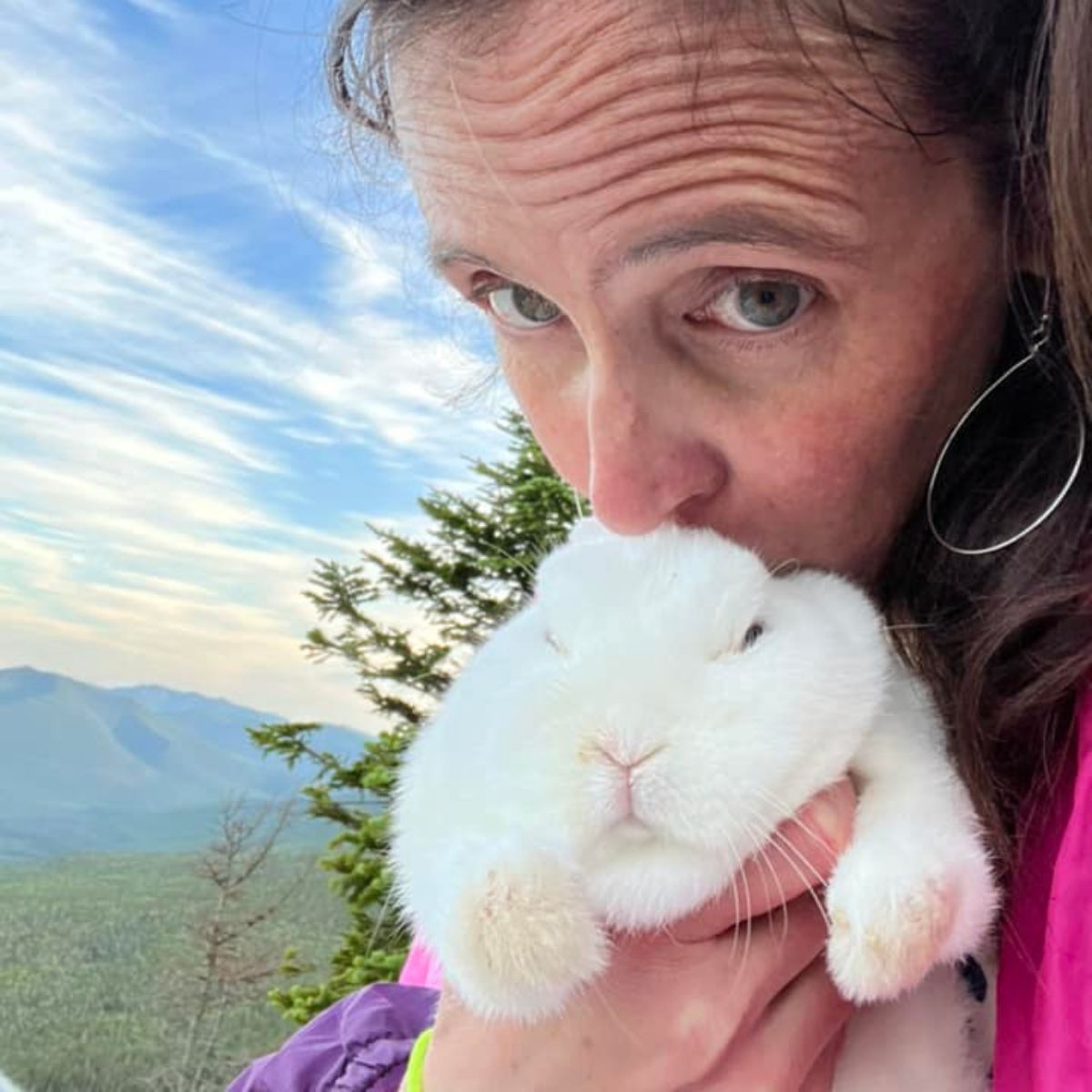 woman kissing a bunny