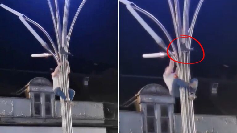Man Risks His Own Safety Climbing A Lamp Post