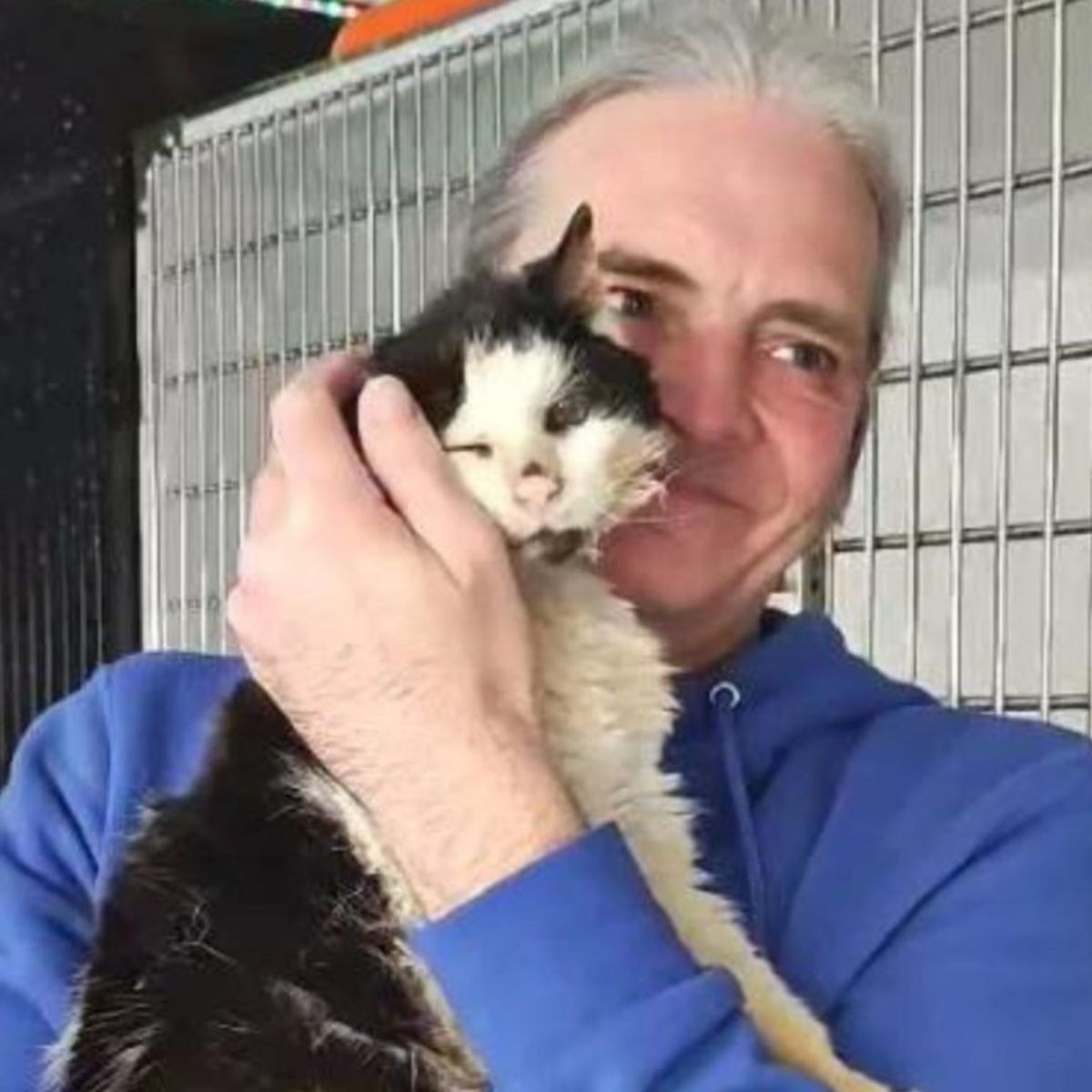 man holding the cat