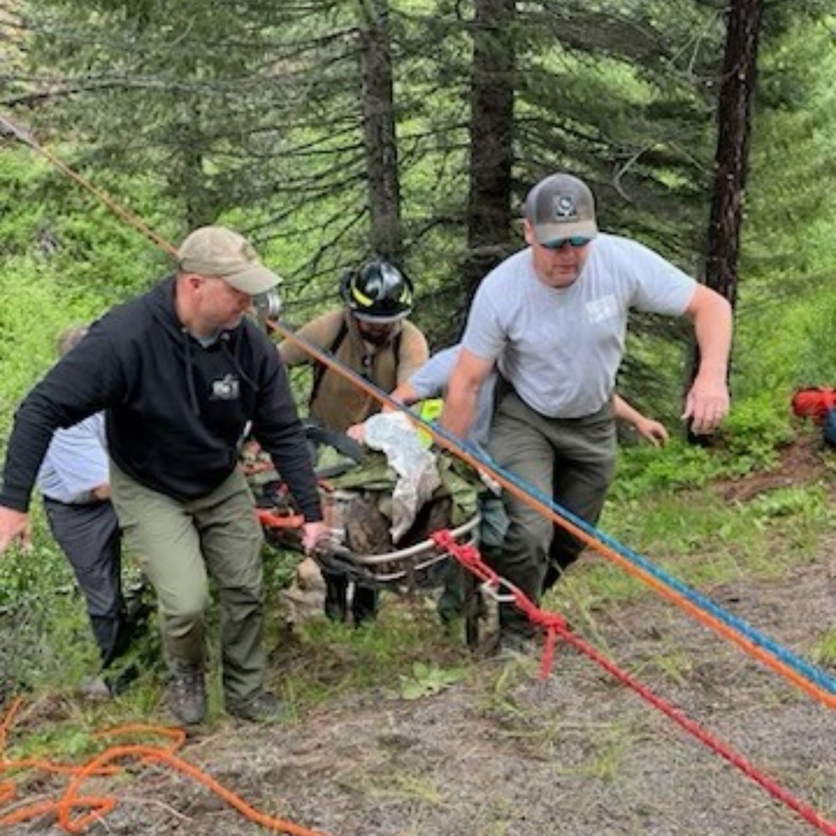 rescuers carrying a man