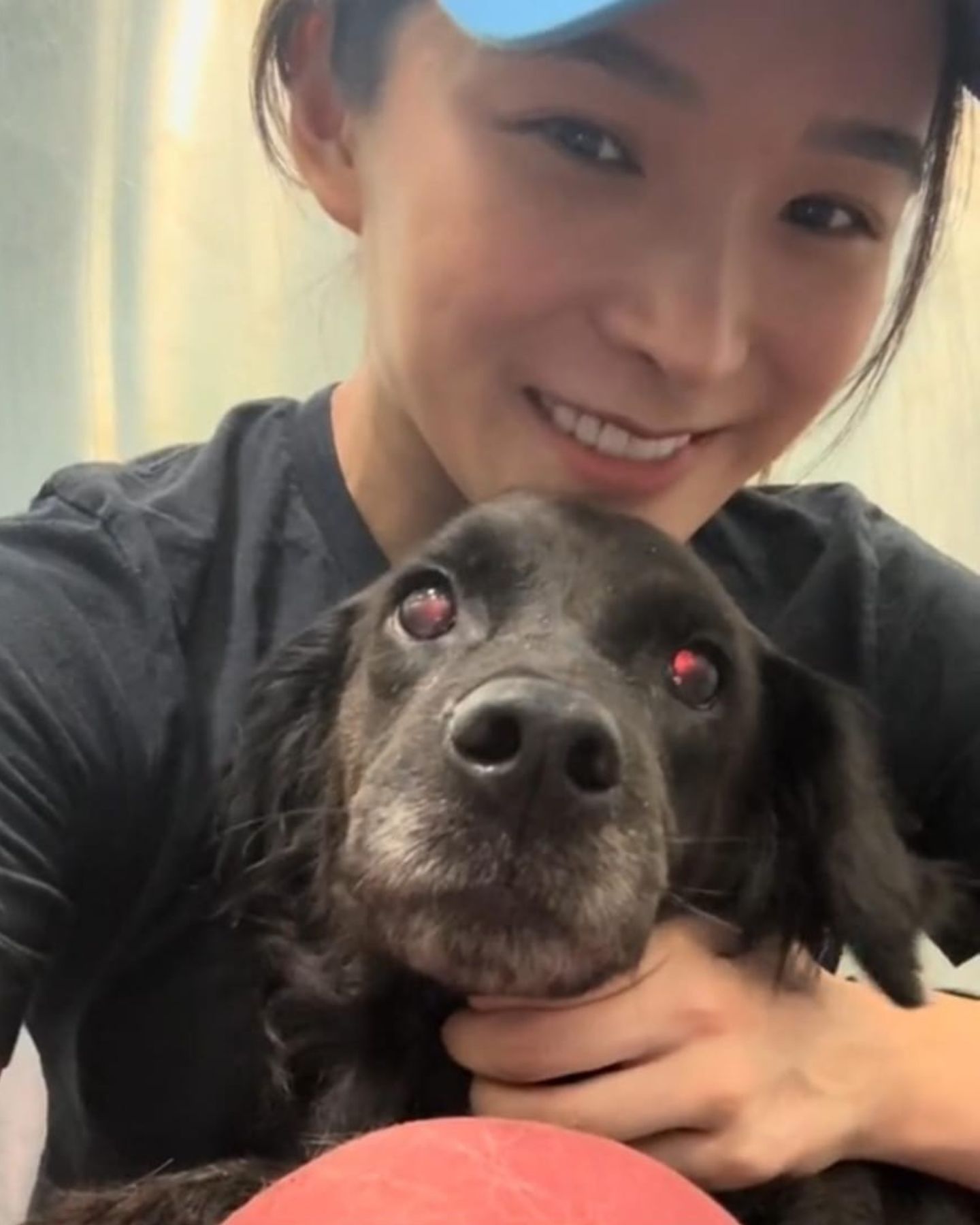 smiling woman posing with dog