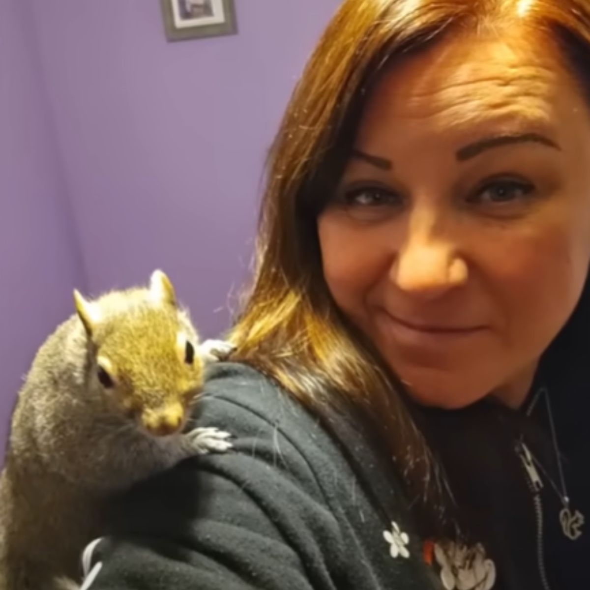 squirrel on womans shoulder