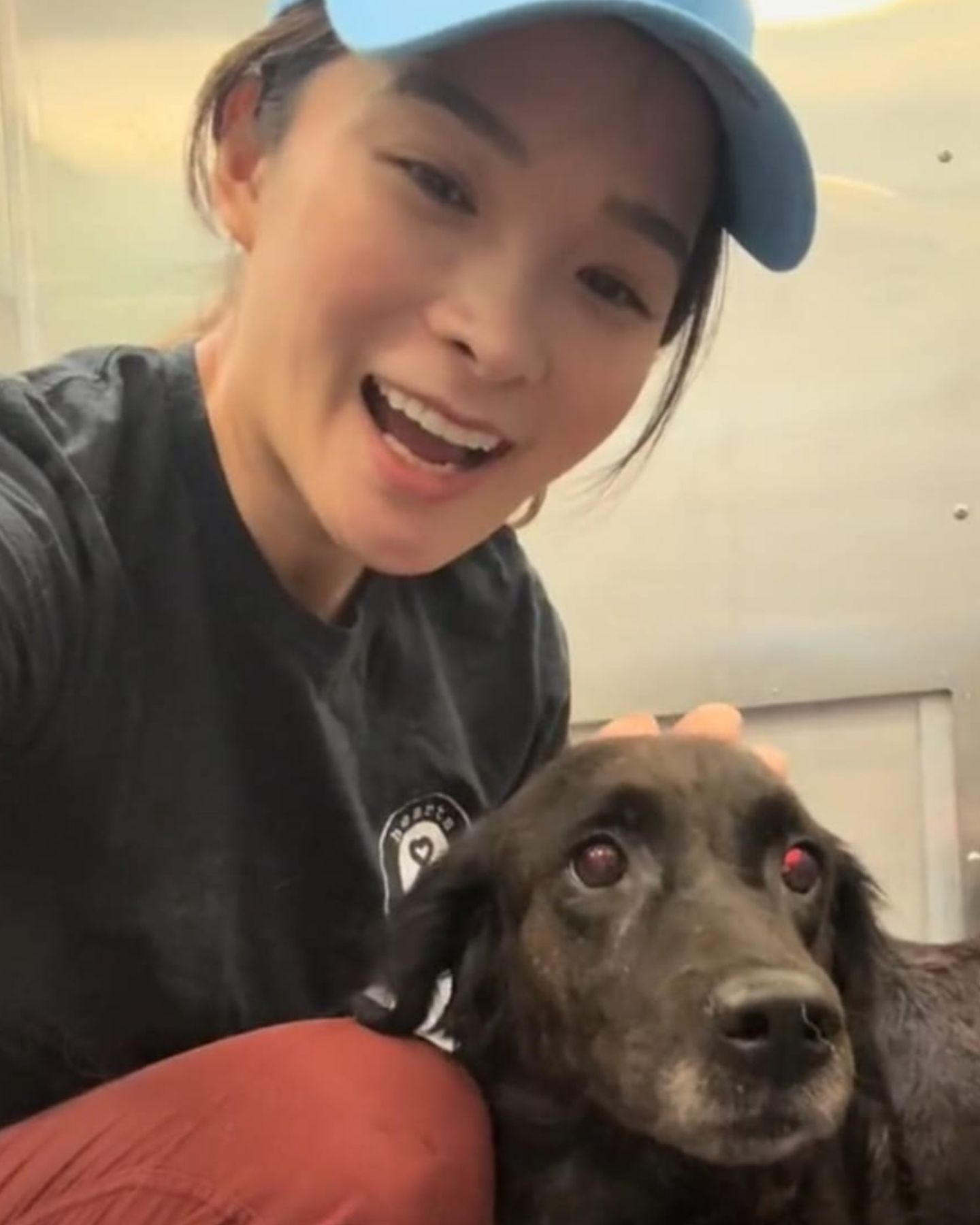 woman smiling with dog