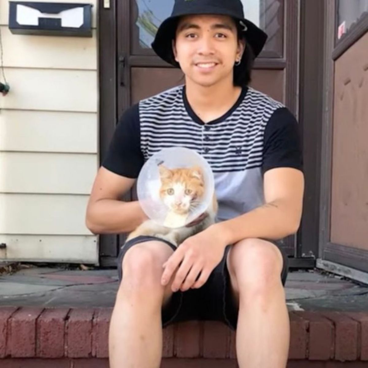 young boy posing with cat