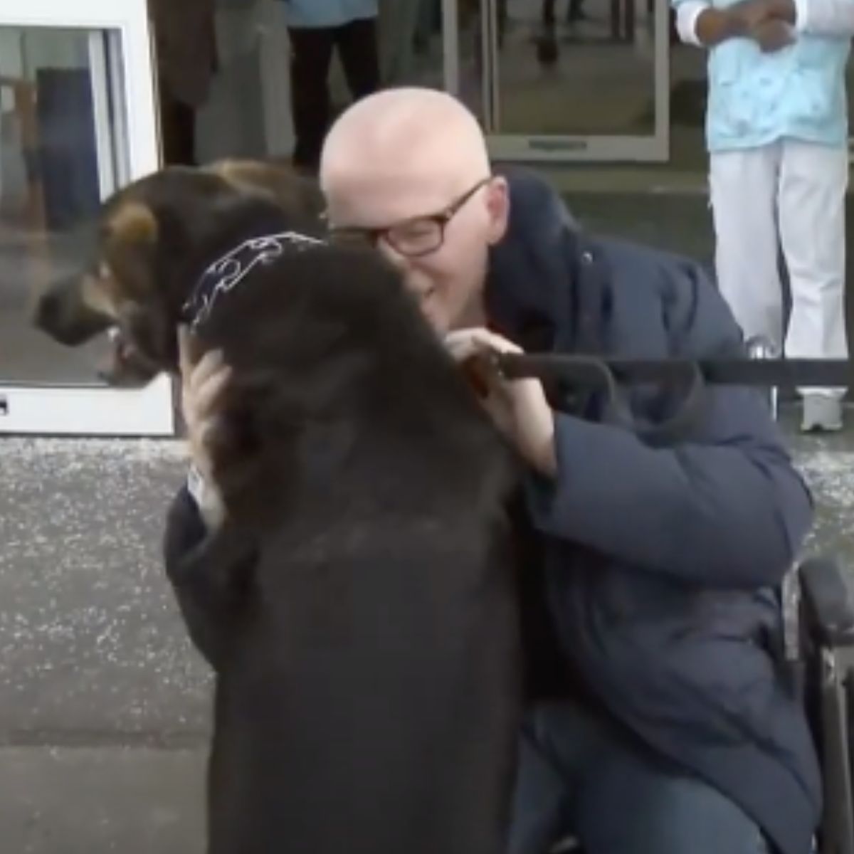 man petting the german shepherd