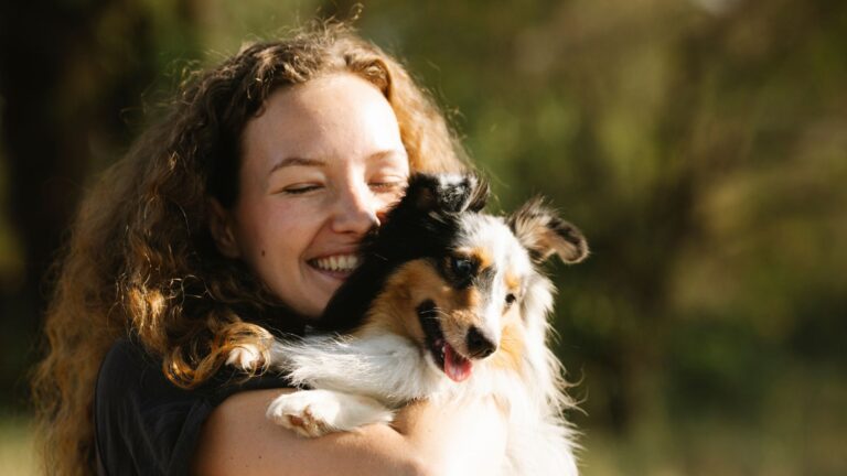 woman hugging a dog