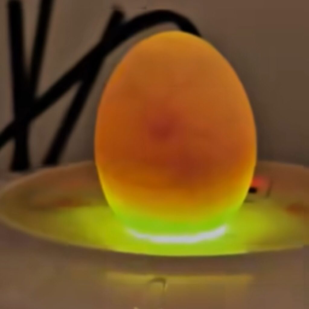 an egg on a plate that glows