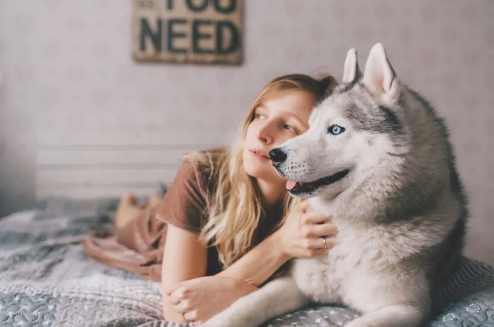 girl hugging dog