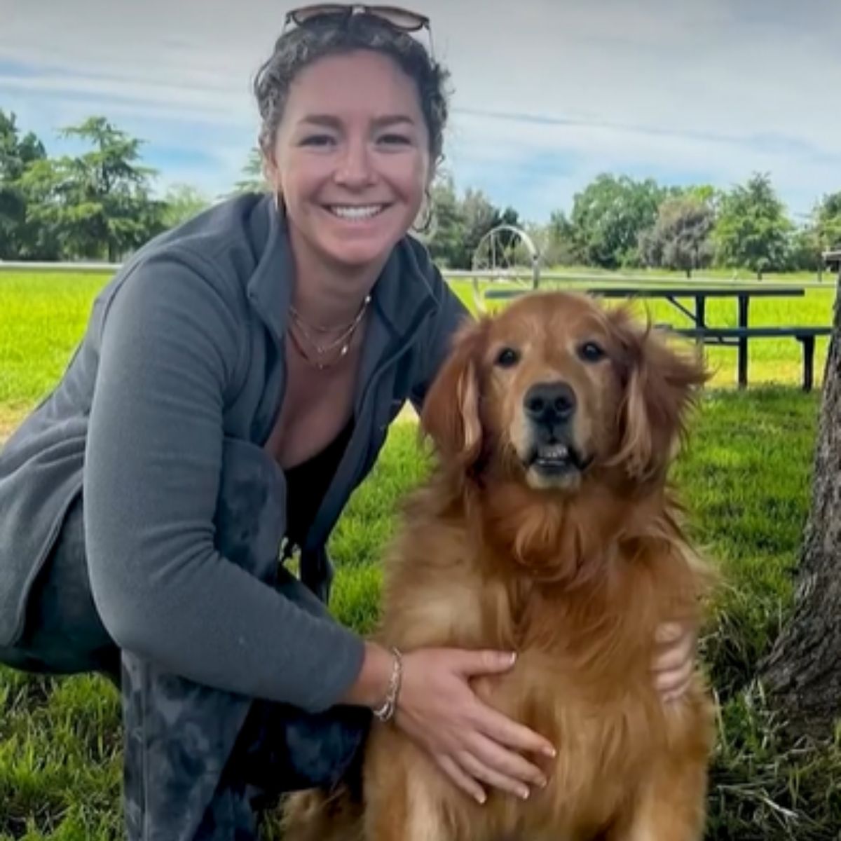 woman and a golden retriever