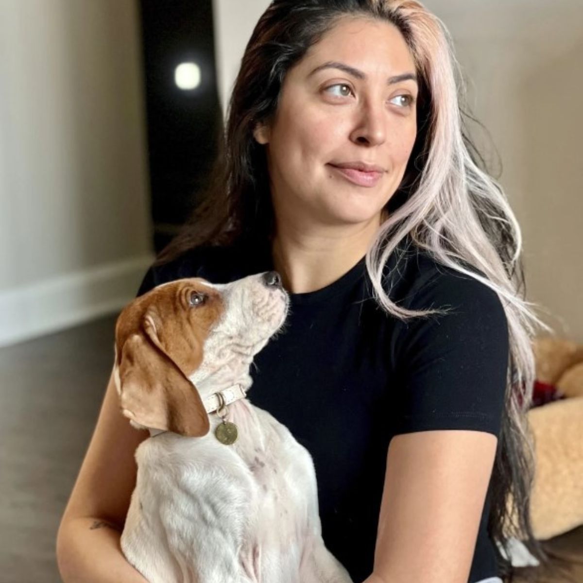 woman holding a cute dog