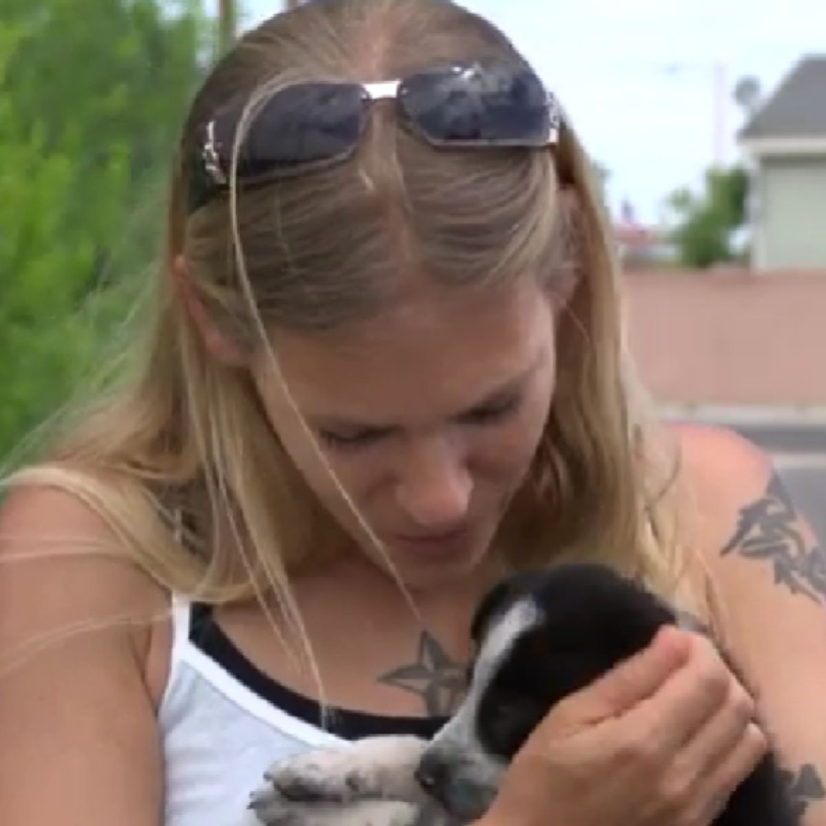 woman holding a puppy