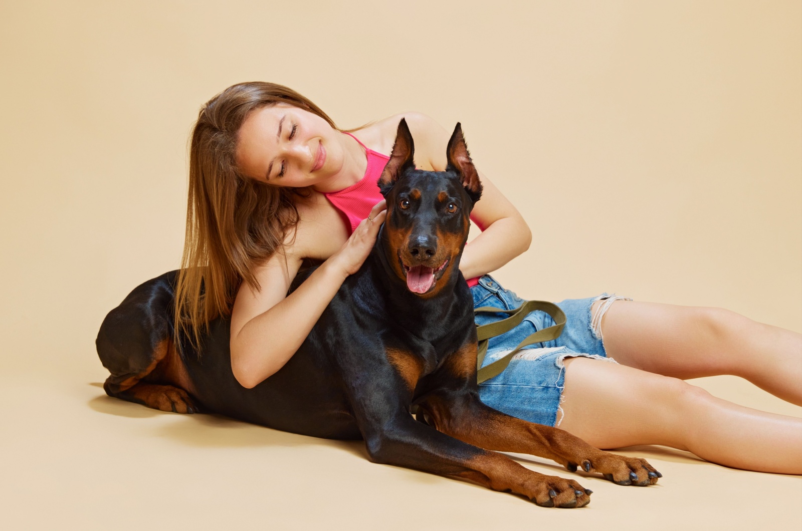 doberman and woman