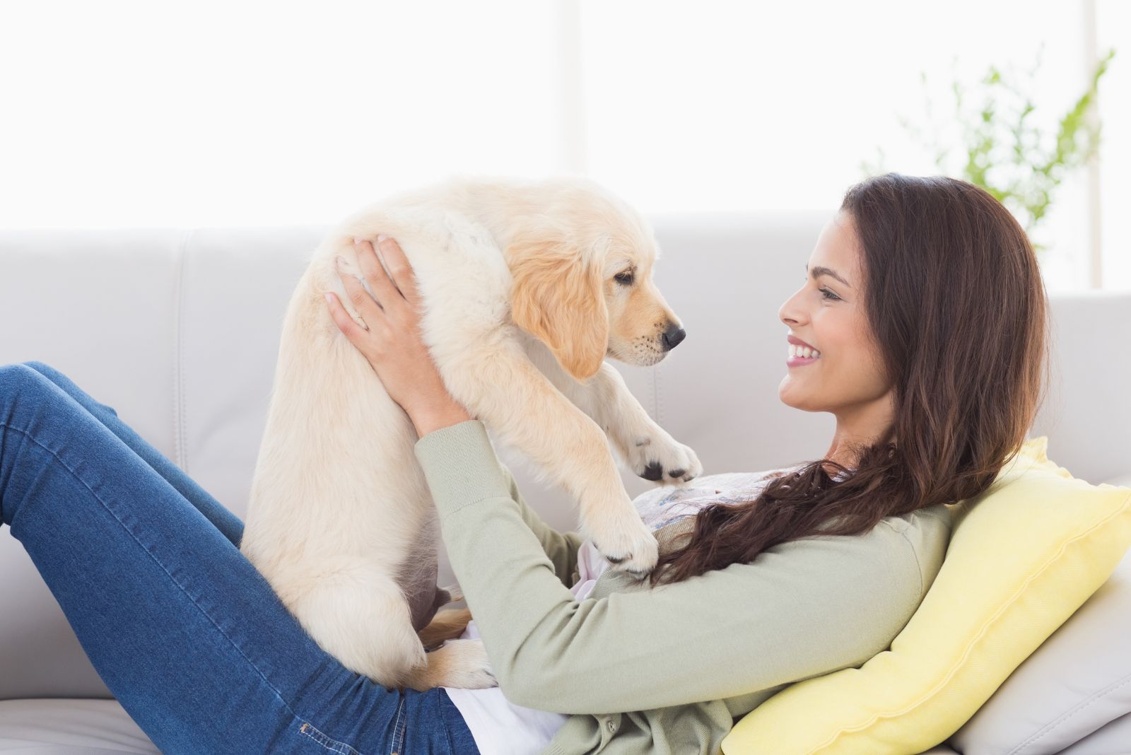 woman holding a puppy