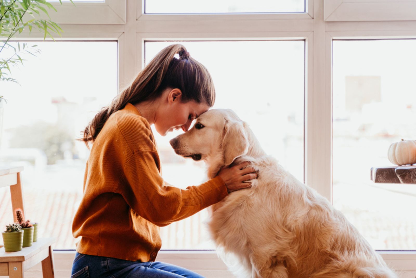 woman in emotional moment with her dog