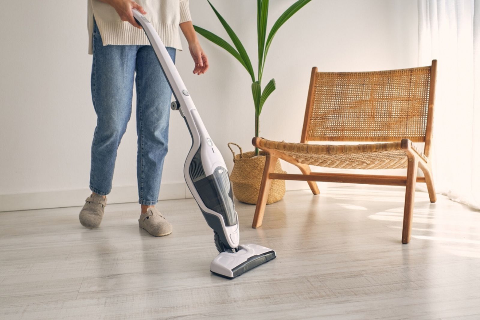 woman using vacuum cleaner