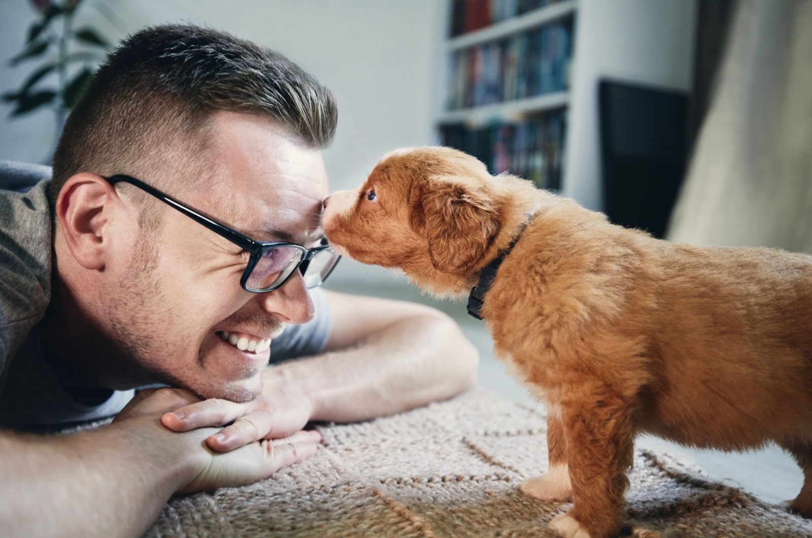 Man and tiny puppy