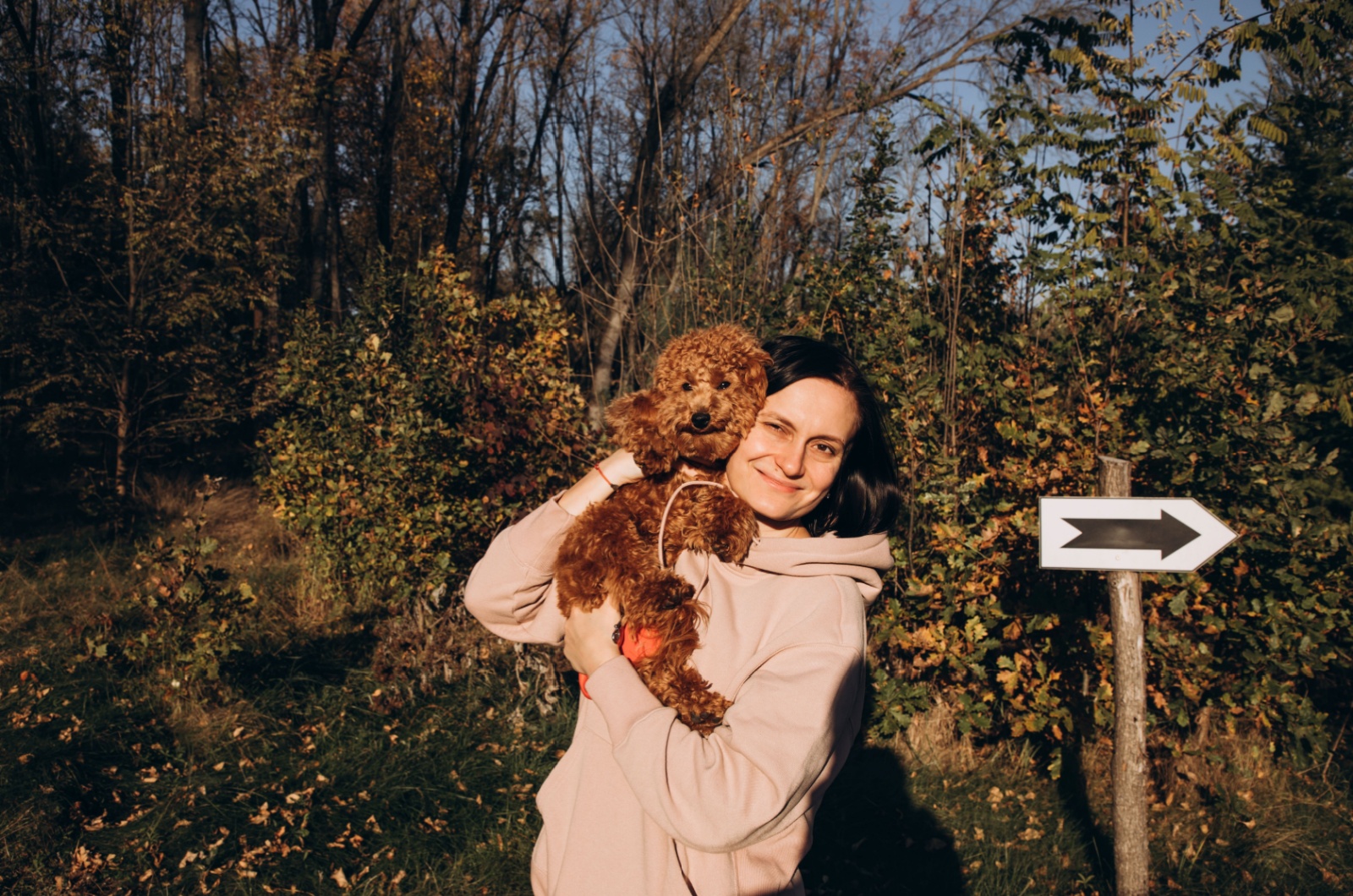 Woman and brown puppy