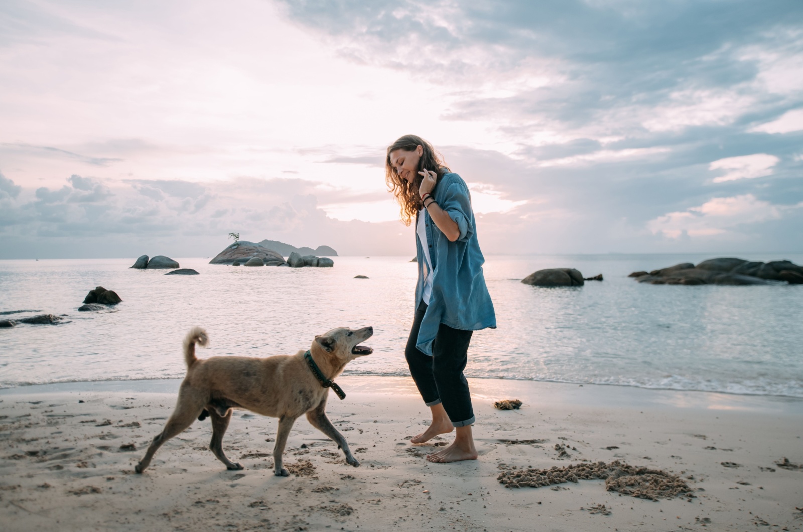 Woman and dog on vacation