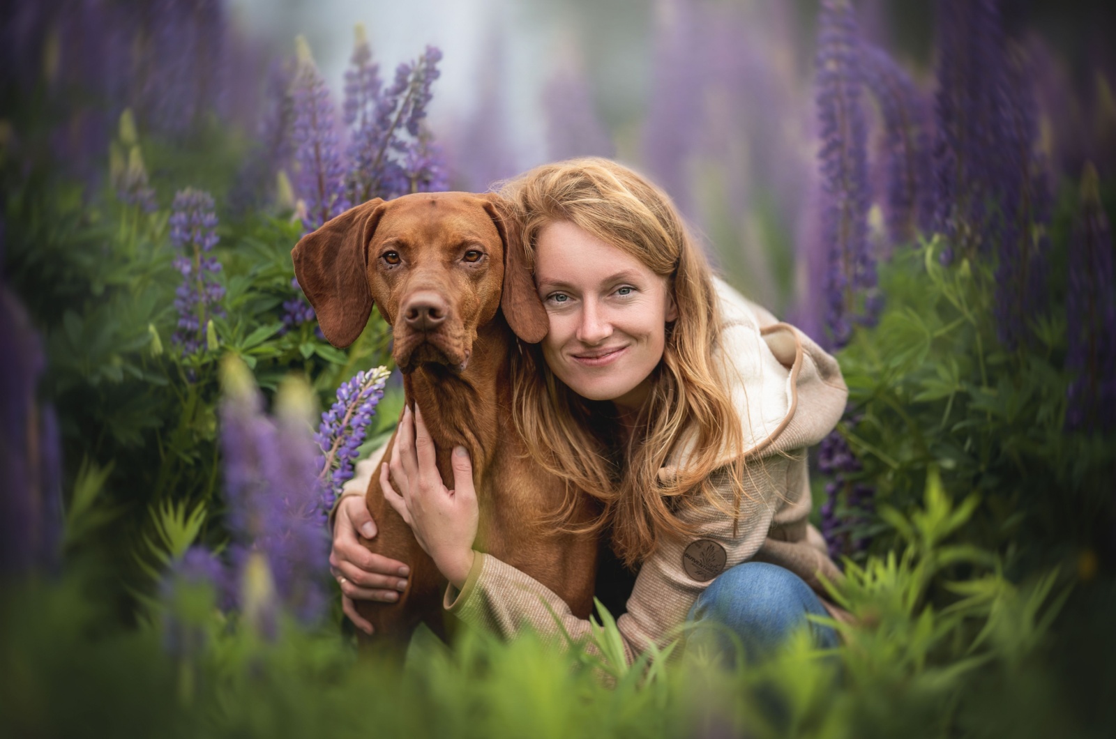 Woman and dog posing for picture