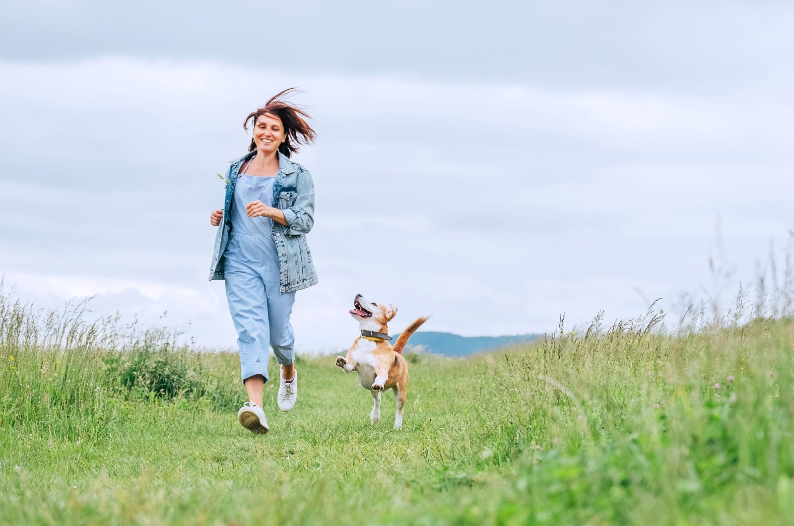 Woman and dog running