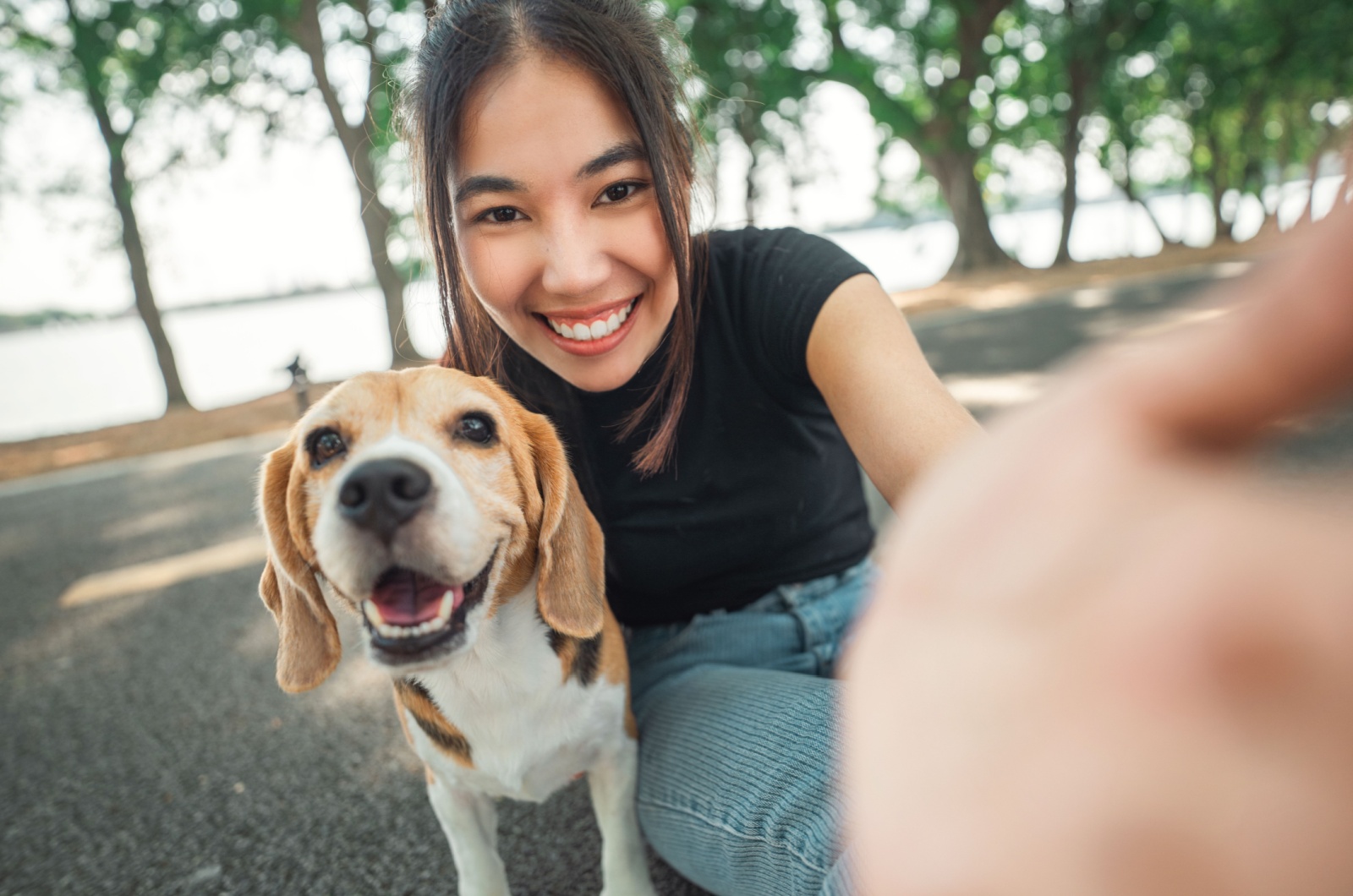 Woman taking a selfie with dog