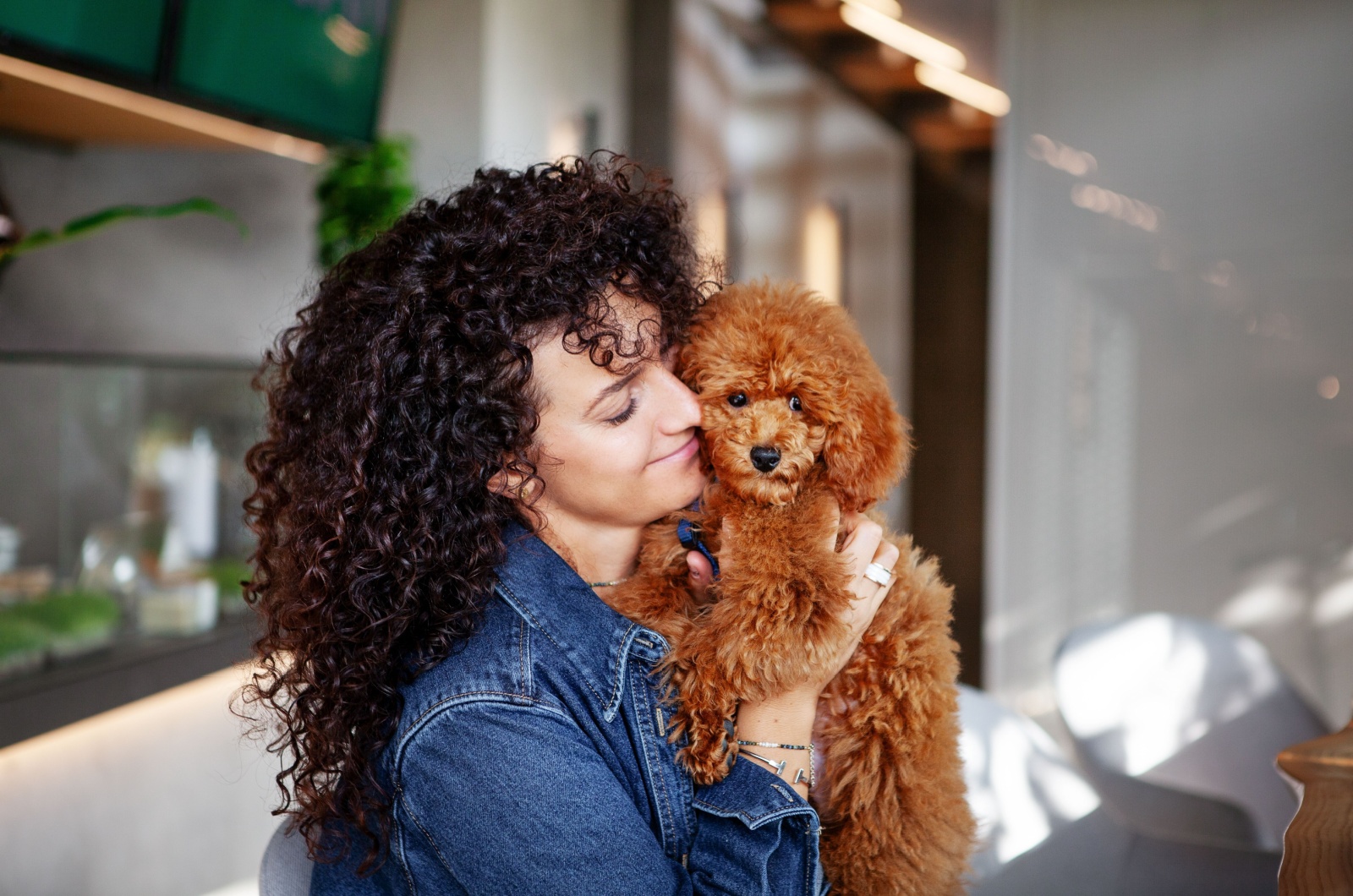 Woman with curly hair and dog