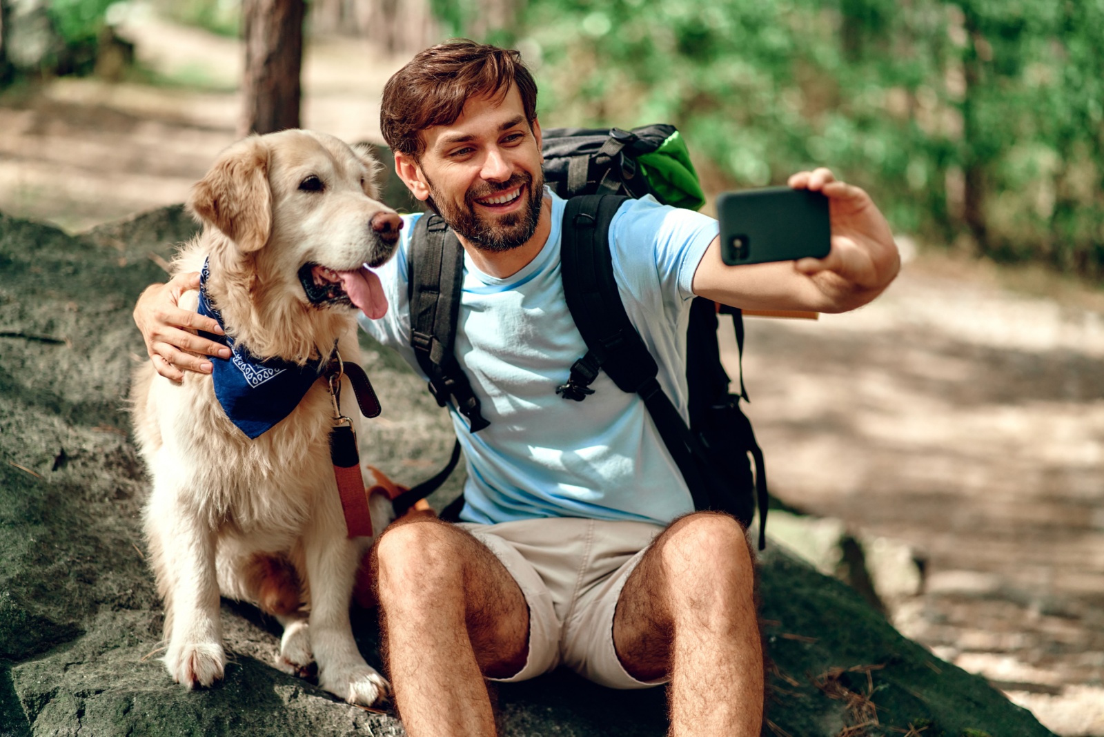 man and dog on a hike