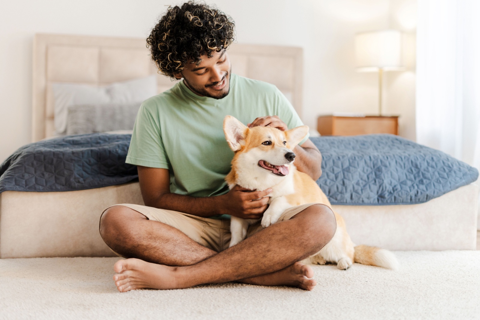 man petting a dog