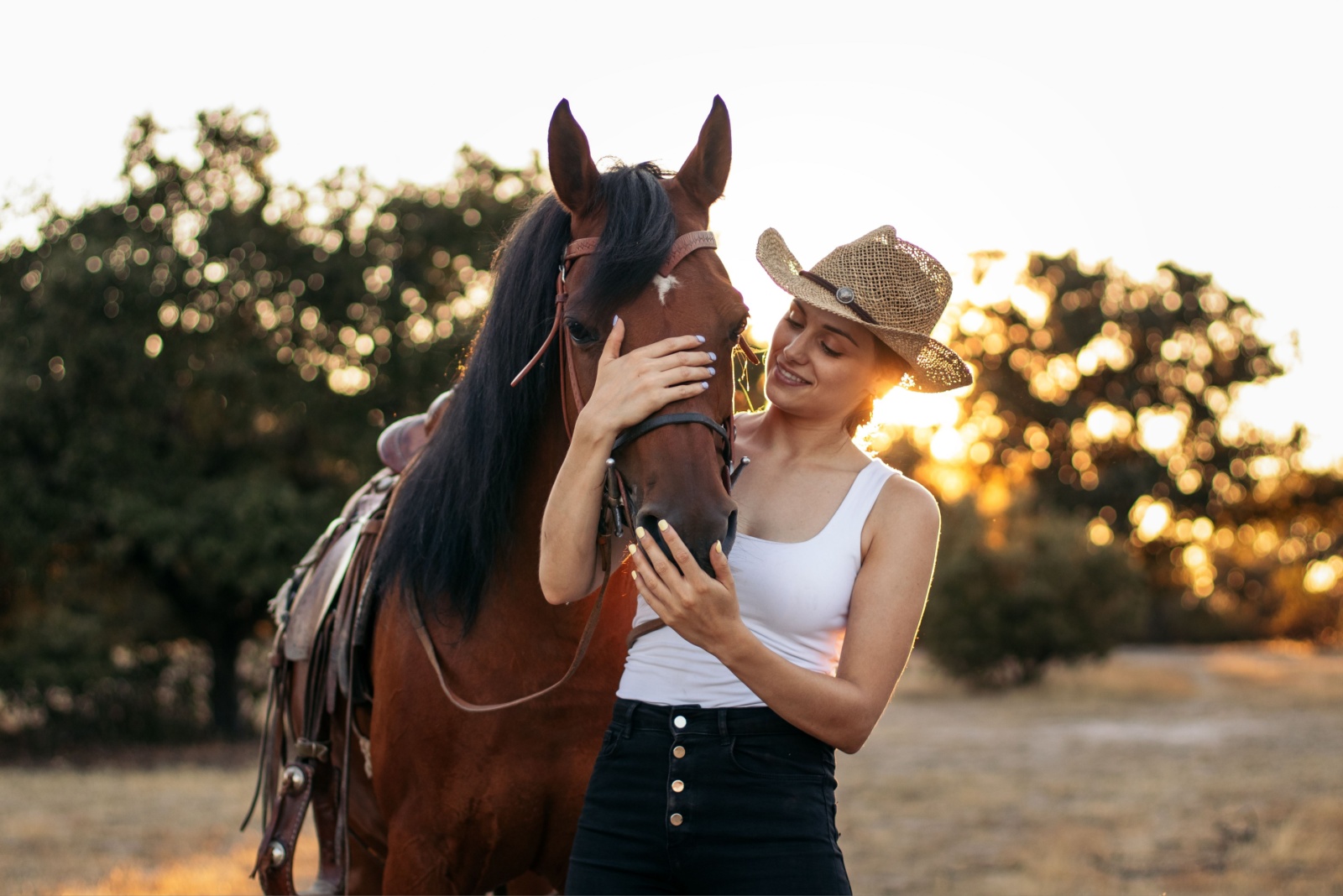 photo of woman with a horse