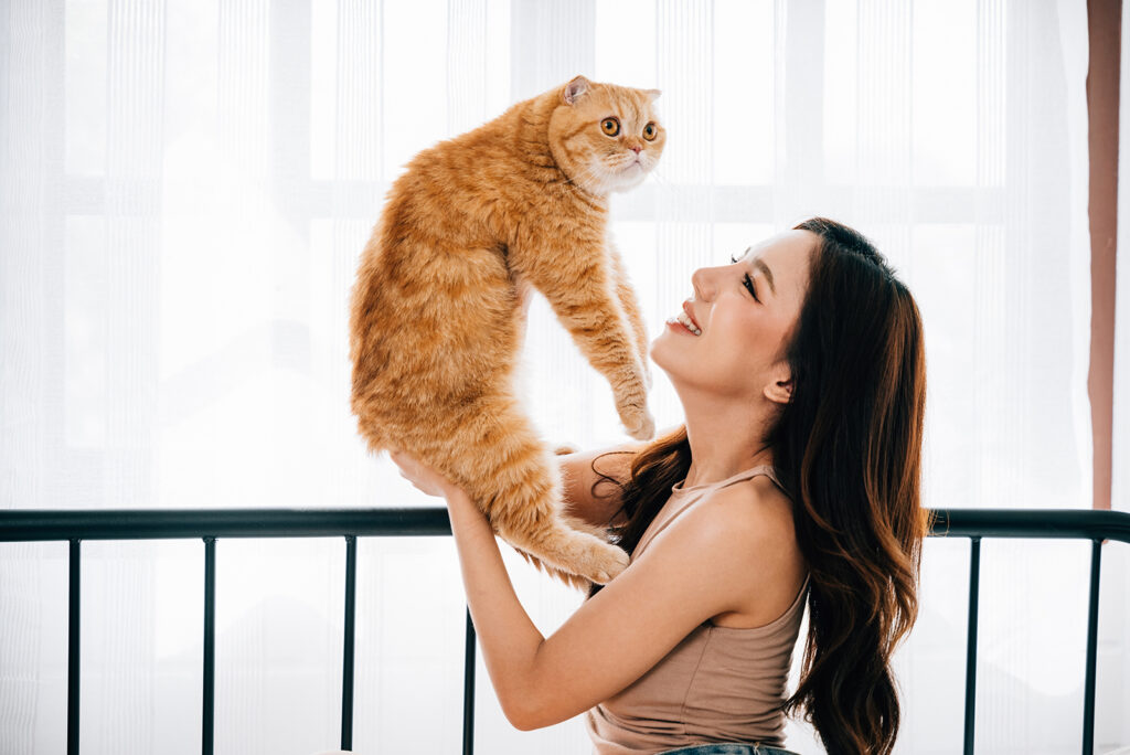 woman holding cat