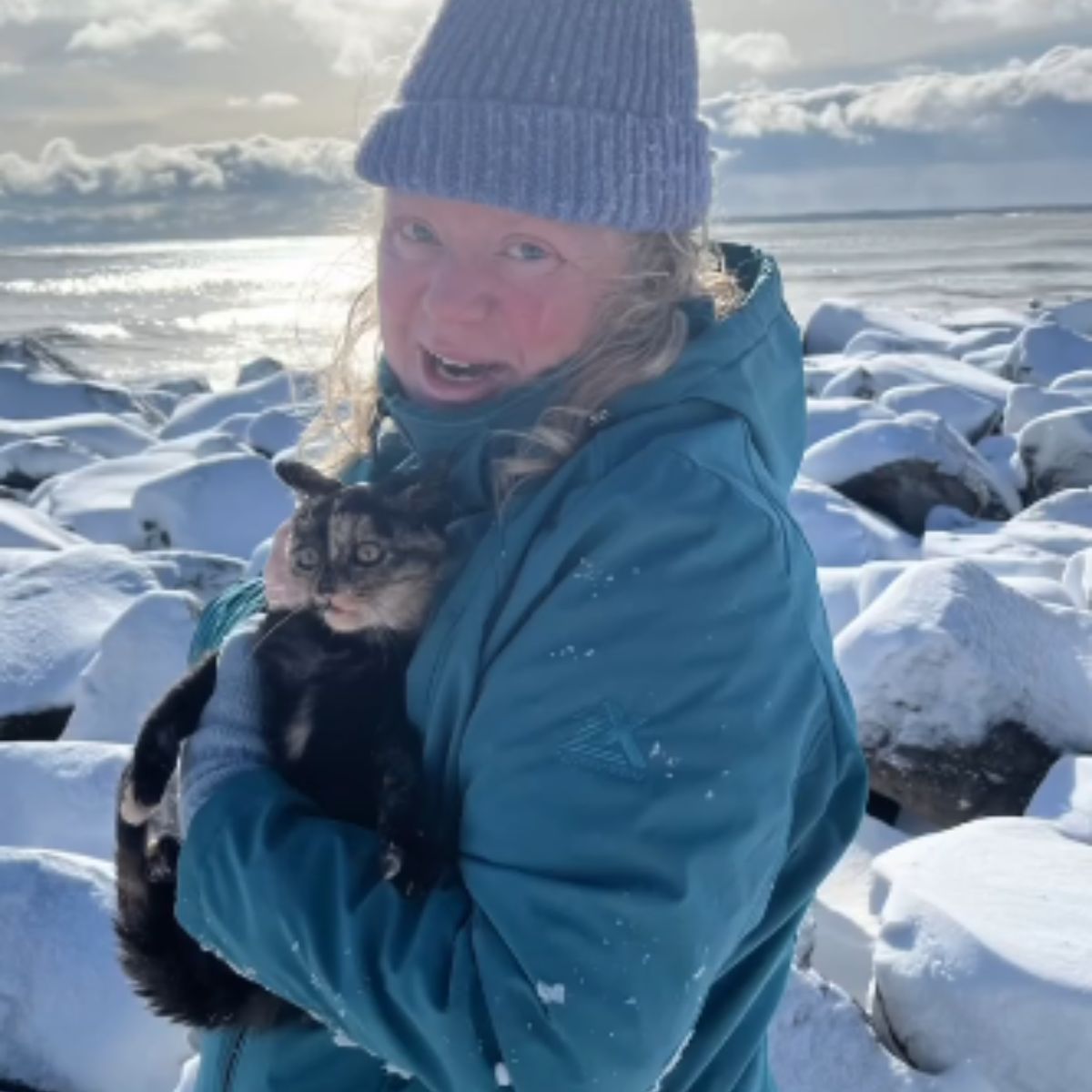 woman holding tiny kitten