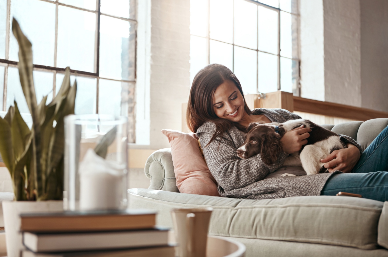 woman relaxing with dog