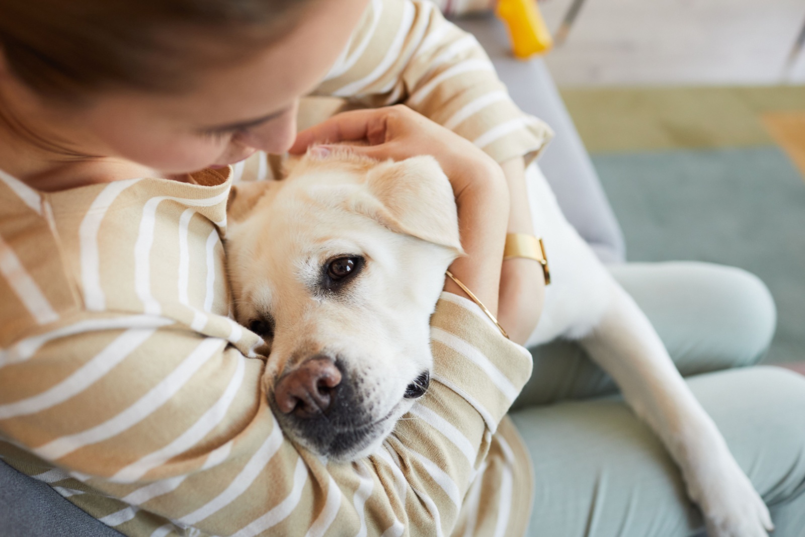 woman hugging dog