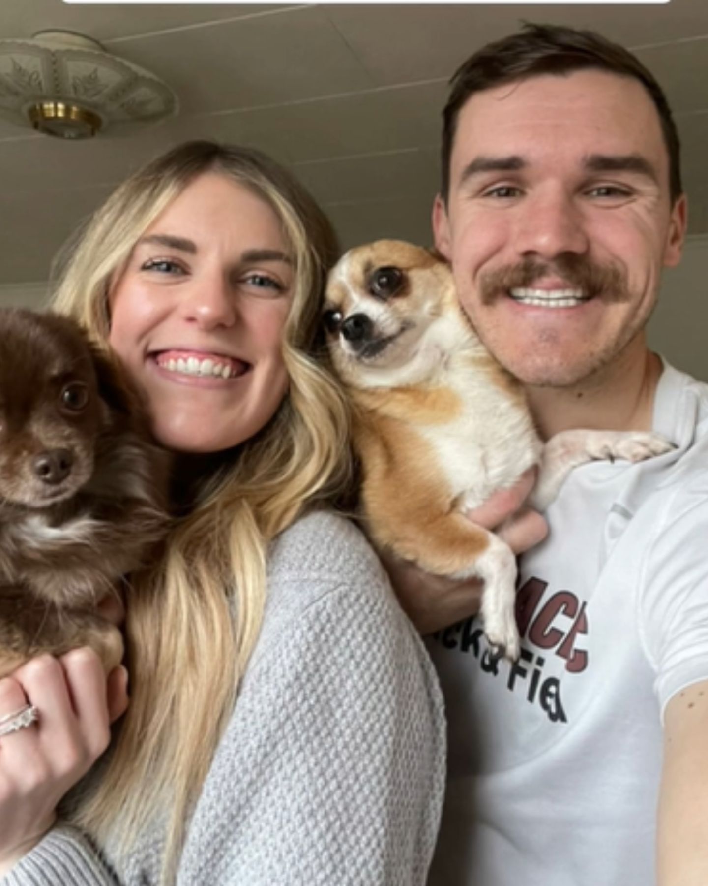 couple and tiny chihuahuas