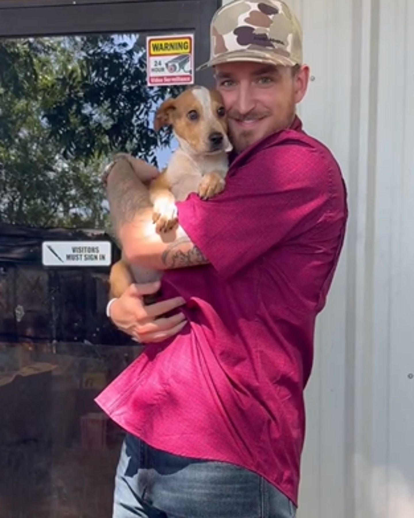 man holding a puppy