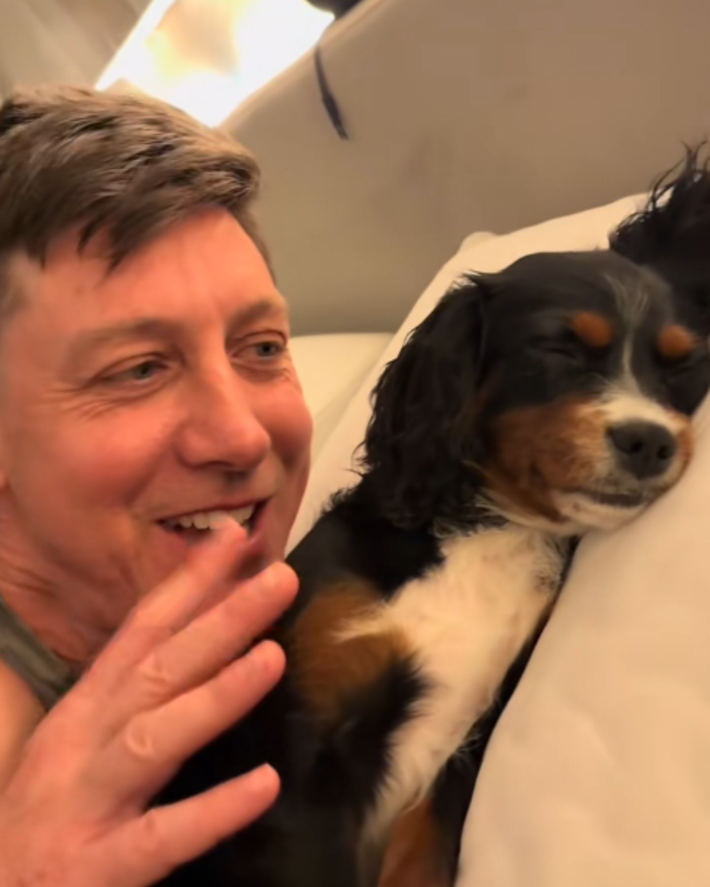 man waking up a dog