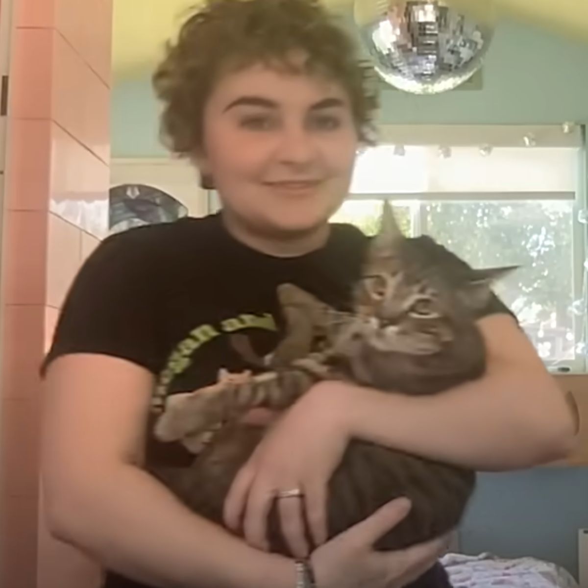 woman holding cat